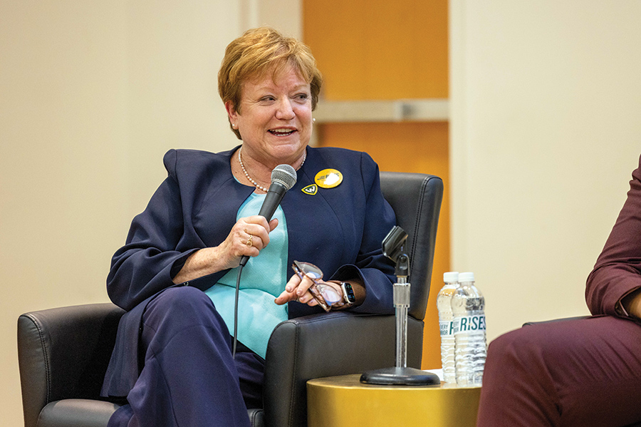 Dr. Laurie M. Lauzon Clabo holding microphone