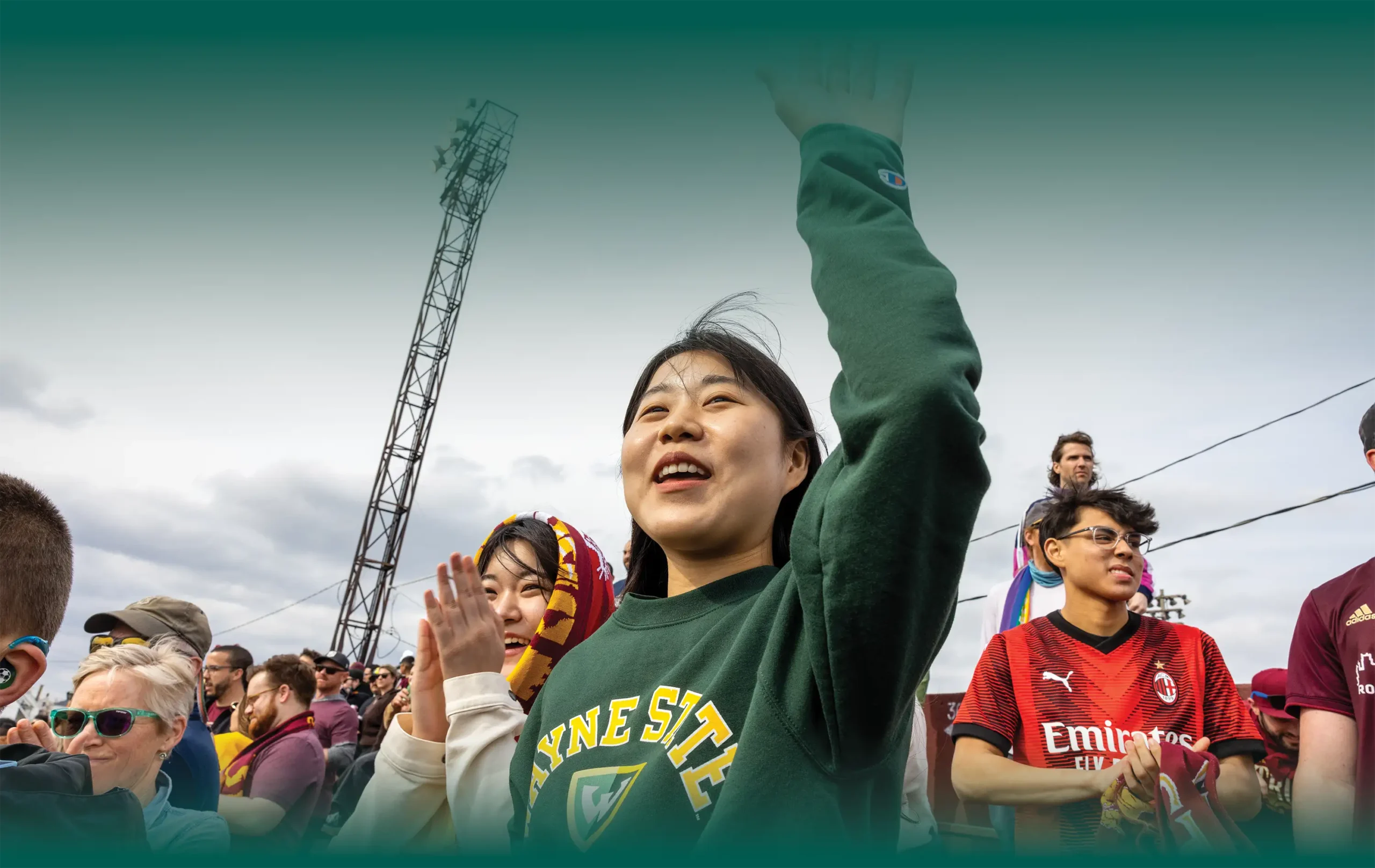 students cheering during sporting event