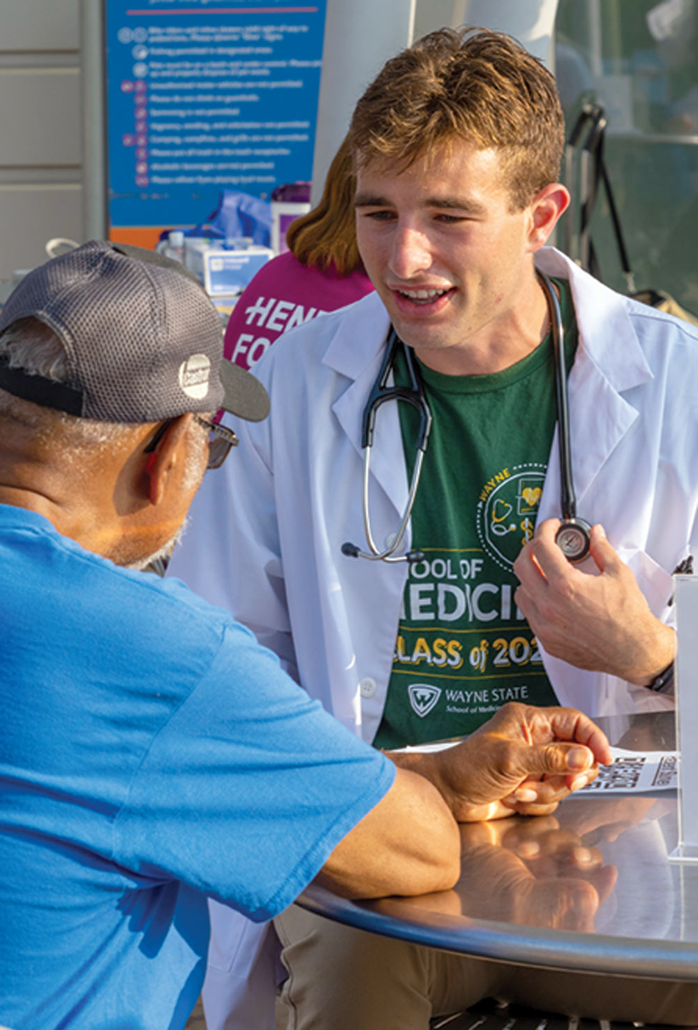 medical student speaking with an older man